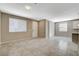 Bright living room featuring neutral paint, tile floors and large windows at 8486 Insignia Ave # 101, Las Vegas, NV 89178