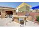 Outdoor kitchen area with grill and seating, ideal for entertaining guests and enjoying outdoor cooking at 8486 Insignia Ave # 101, Las Vegas, NV 89178