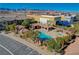 Aerial view of community pool, spa, lounge area, and adjacent parking at 8486 Insignia Ave # 101, Las Vegas, NV 89178