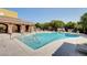 Resort-style community pool with lounge chairs and ample seating, perfect for relaxing and enjoying the sun at 8486 Insignia Ave # 101, Las Vegas, NV 89178