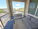Comfortable balcony seating offering an outdoor space with neighborhood views and a serene atmosphere at 8534 Insignia Ave # 101, Las Vegas, NV 89178