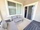 Inviting outdoor space with patio furniture and a sliding door providing seamless indoor-outdoor living at 8534 Insignia Ave # 101, Las Vegas, NV 89178
