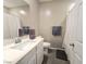 Neutral bathroom featuring a toilet, vanity with one sink, and a shower with curtain at 8534 Insignia Ave # 101, Las Vegas, NV 89178