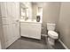 Neutral bathroom with grey tile flooring, toilet, vanity with one sink, and a shower at 8534 Insignia Ave # 101, Las Vegas, NV 89178