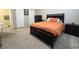 Neutral bedroom featuring a comfortable bed, two closets, and an ensuite bathroom at 8534 Insignia Ave # 101, Las Vegas, NV 89178
