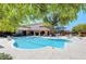 Beautiful outdoor pool surrounded by lounge chairs, cabanas, and lush greenery at 8534 Insignia Ave # 101, Las Vegas, NV 89178