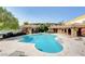 Relaxing swimming pool area with lounge chairs and covered seating for ultimate comfort and enjoyment at 8534 Insignia Ave # 101, Las Vegas, NV 89178