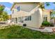 Exterior of a home with lush green grass and a patio area at 8612 Danza Del Sol Dr, Las Vegas, NV 89128