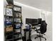 Brightly-lit bedroom with a desk, monitors, bookshelf, and clean finishes at 8612 Danza Del Sol Dr, Las Vegas, NV 89128