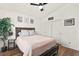 Comfortable bedroom with wood floors, natural light, and a closet at 8612 Danza Del Sol Dr, Las Vegas, NV 89128