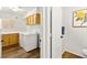 Bright laundry room with cabinets, counters, and new washer and dryer at 8612 Danza Del Sol Dr, Las Vegas, NV 89128