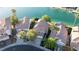Aerial view of several homes on the water with a blue sky backdrop at 8740 Captains Pl, Las Vegas, NV 89117