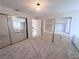 Bedroom featuring built-in shelves and mirrored closet doors at 8740 Captains Pl, Las Vegas, NV 89117