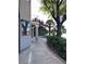 Exterior side view with manicured landscaping and mature trees at 8740 Captains Pl, Las Vegas, NV 89117