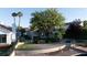 Charming waterfront home featuring lush landscaping and a private backyard at 8740 Captains Pl, Las Vegas, NV 89117