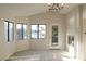 Spacious living room with lake views, a fireplace, neutral carpet, and recessed lighting at 8740 Captains Pl, Las Vegas, NV 89117