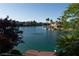 Scenic waterfront view showcasing the serene lake and well-manicured surroundings at 8740 Captains Pl, Las Vegas, NV 89117