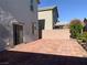 Spacious brick-paved backyard with slider and side window to the home at 8793 Candelabra Ct, Las Vegas, NV 89148