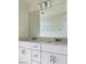 Bright bathroom featuring double sink vanity, quartz countertops and chrome hardware at 8793 Candelabra Ct, Las Vegas, NV 89148