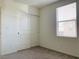 This bedroom features a view out the window and a large closet at 8793 Candelabra Ct, Las Vegas, NV 89148