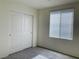 A bedroom features a large closet and a window at 8793 Candelabra Ct, Las Vegas, NV 89148
