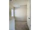 An empty bedroom features neutral carpeting and a window for natural light at 8793 Candelabra Ct, Las Vegas, NV 89148