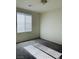 Carpeted bedroom with natural light from the window at 8793 Candelabra Ct, Las Vegas, NV 89148