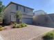 Two story home with brick paver driveway and walkway at 8793 Candelabra Ct, Las Vegas, NV 89148