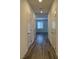 Hallway with wood floors and white doors at 8793 Candelabra Ct, Las Vegas, NV 89148