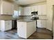 Open kitchen with stainless steel appliances, granite countertops, and ample counter space at 8793 Candelabra Ct, Las Vegas, NV 89148