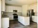 Modern kitchen with white cabinets, stainless steel appliances, and an island at 8793 Candelabra Ct, Las Vegas, NV 89148