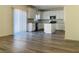 Bright and airy kitchen featuring white cabinets, stainless steel appliances and wood look floors at 8793 Candelabra Ct, Las Vegas, NV 89148