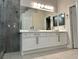Stylish bathroom featuring a double vanity, updated fixtures and modern design at 8931 Lansberry Ct, Las Vegas, NV 89147