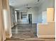Open bedroom space boasting vaulted ceilings, modern flooring, and a view of the ensuite at 8931 Lansberry Ct, Las Vegas, NV 89147