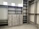 Walk-in closet featuring custom built-ins for optimal storage, shelving, and drawers at 8931 Lansberry Ct, Las Vegas, NV 89147