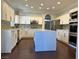 Modern kitchen showcases a large island, stainless appliances, and ample storage space at 8931 Lansberry Ct, Las Vegas, NV 89147
