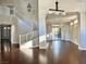 Open-concept living room with a spiral staircase, hardwood floors and backyard access at 8931 Lansberry Ct, Las Vegas, NV 89147