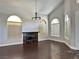 Inviting living room with a fireplace, hardwood floors and large windows at 8931 Lansberry Ct, Las Vegas, NV 89147