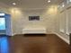 Bright living room with an accent wall, recessed lighting and hardwood floors at 8931 Lansberry Ct, Las Vegas, NV 89147