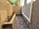 Compact side yard features a brick-paved patio area ideal for small outdoor gatherings or relaxation at 8931 Lansberry Ct, Las Vegas, NV 89147