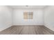 Bright bedroom with modern vinyl flooring and a window for natural light at 9173 Weeping Hollow Ave, Las Vegas, NV 89178
