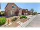View of a two-story home with a landscaped front yard on a sunny day at 9173 Weeping Hollow Ave, Las Vegas, NV 89178