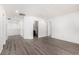 Upstairs hallway with wood laminate flooring and access to multiple rooms at 9173 Weeping Hollow Ave, Las Vegas, NV 89178