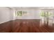 Open-concept living room featuring hardwood floors and bright natural light at 9173 Weeping Hollow Ave, Las Vegas, NV 89178