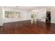 Spacious living room area featuring beautiful hardwood flooring at 9173 Weeping Hollow Ave, Las Vegas, NV 89178