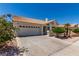Beautiful single-story home with desert landscaping, tile roof, and attached garage at 9305 Hollycrest Dr, Las Vegas, NV 89117