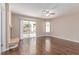 Bright living room with fireplace, ceiling fan and sliding doors to the backyard at 9305 Hollycrest Dr, Las Vegas, NV 89117