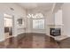 Bright living room with hardwood floors, fireplace, and large windows at 9305 Hollycrest Dr, Las Vegas, NV 89117