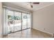 Sliding glass doors from a room lead to an enclosed backyard patio at 9305 Hollycrest Dr, Las Vegas, NV 89117