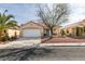 Charming single-story home featuring a well-maintained yard, a two-car garage and drought-tolerant landscaping at 9378 Spellman Ct, Las Vegas, NV 89123